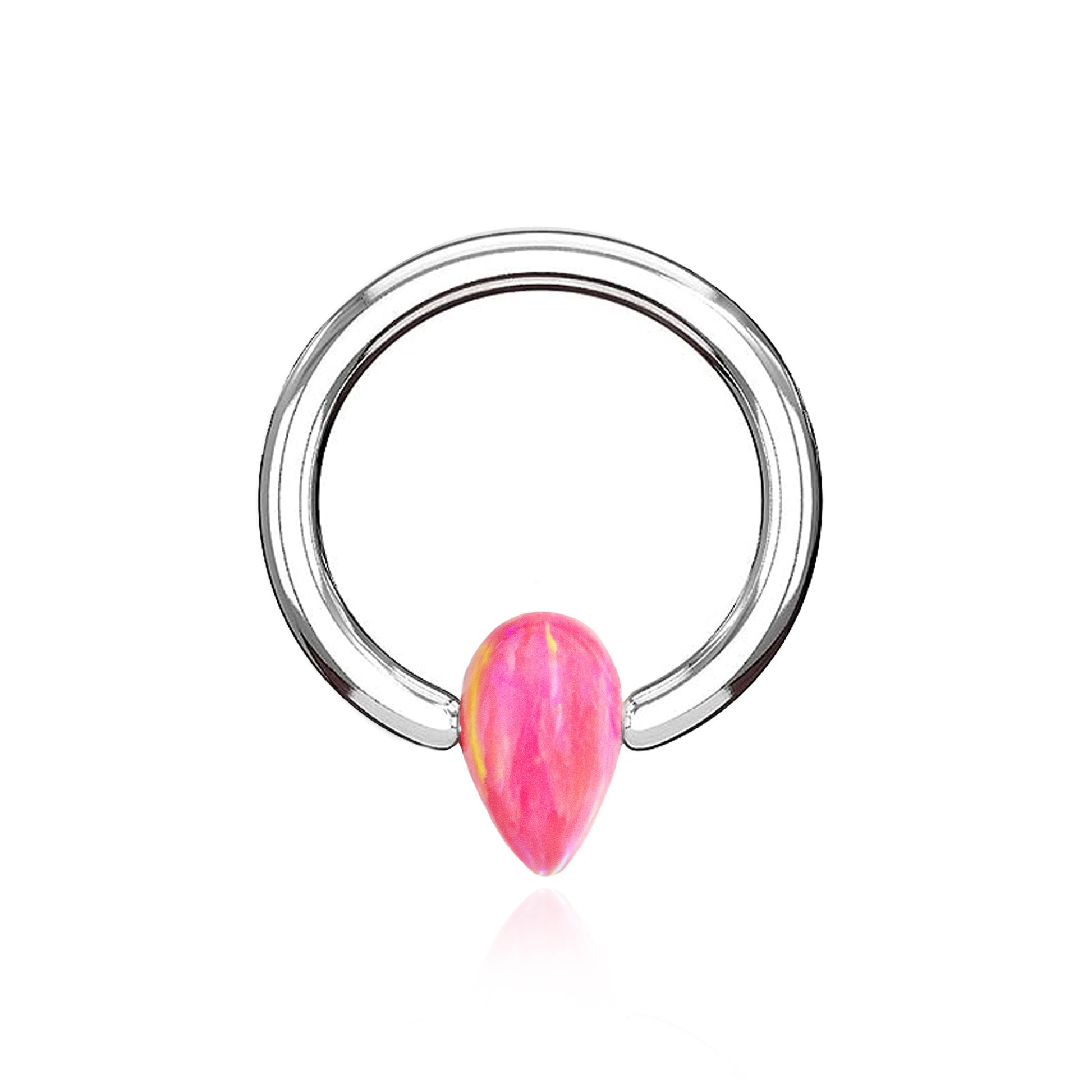 Ring in titanio ASTM F136 da implantologia certificato con opale. Questo scintillante ring realizzato in titanio nella parte frontale presenta uno splendido opale rosa "hot pink" che arricchisce il gioiello.